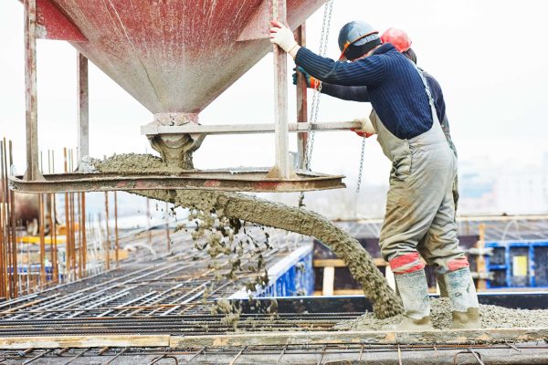 workers pouring concrete foundationConcrete